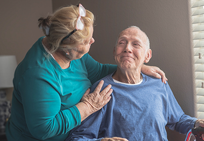 understanding palliative care end of life care training image of elderly wife comforting husband by project compassion